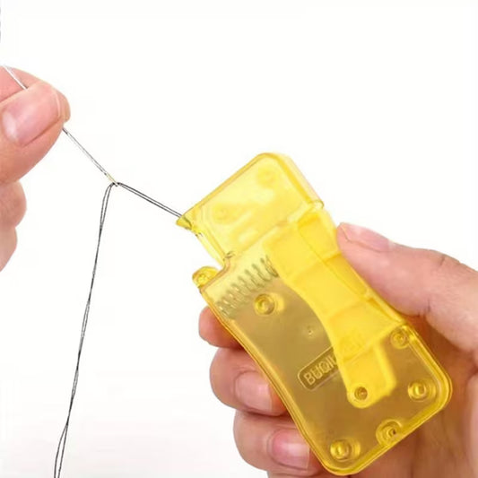 Yellow fishing line counter device held by a hand on a white background